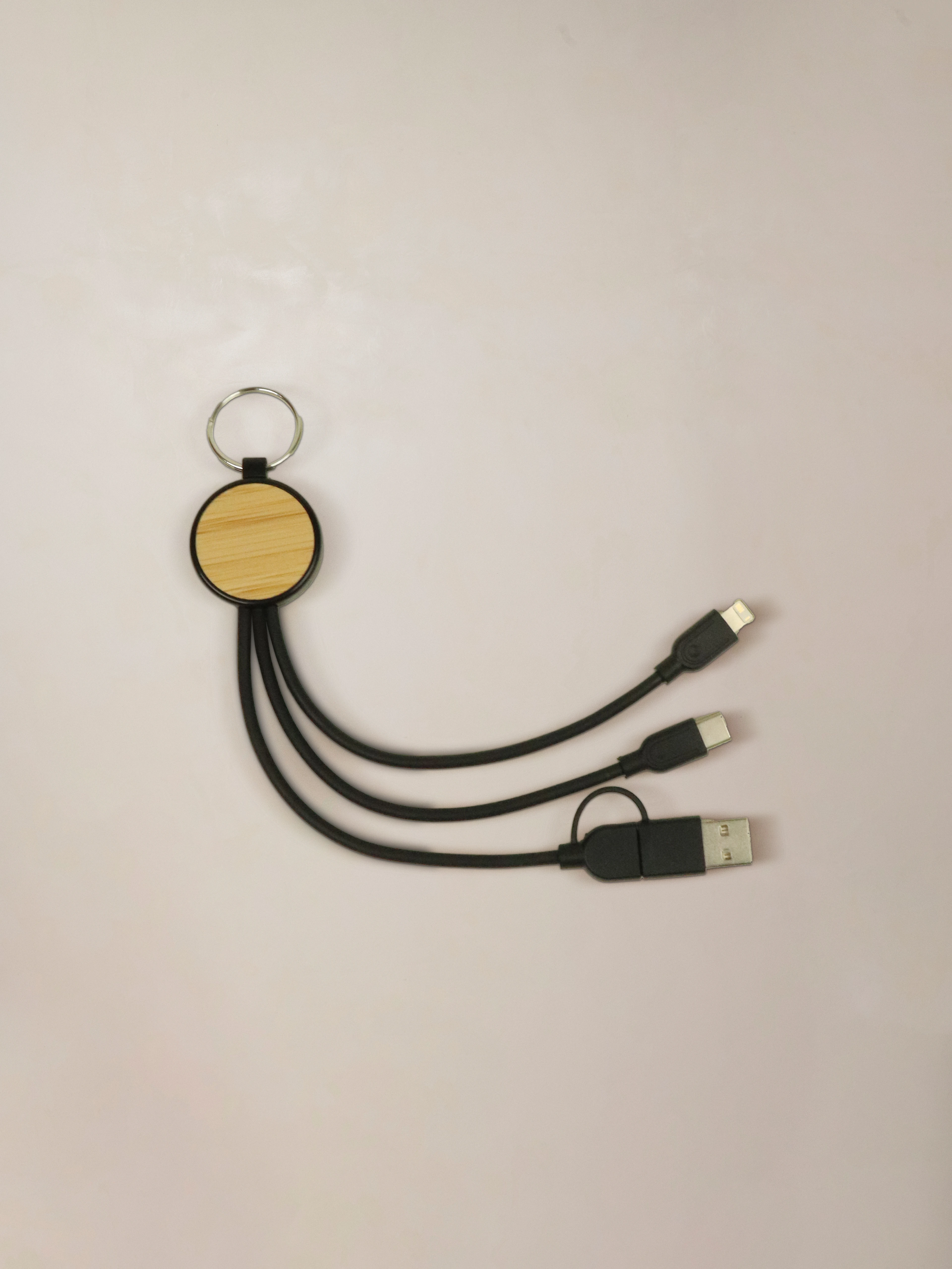 Eco-friendly charging cable made from bamboo and recycled plastic, designed with essential connections for everyday charging.