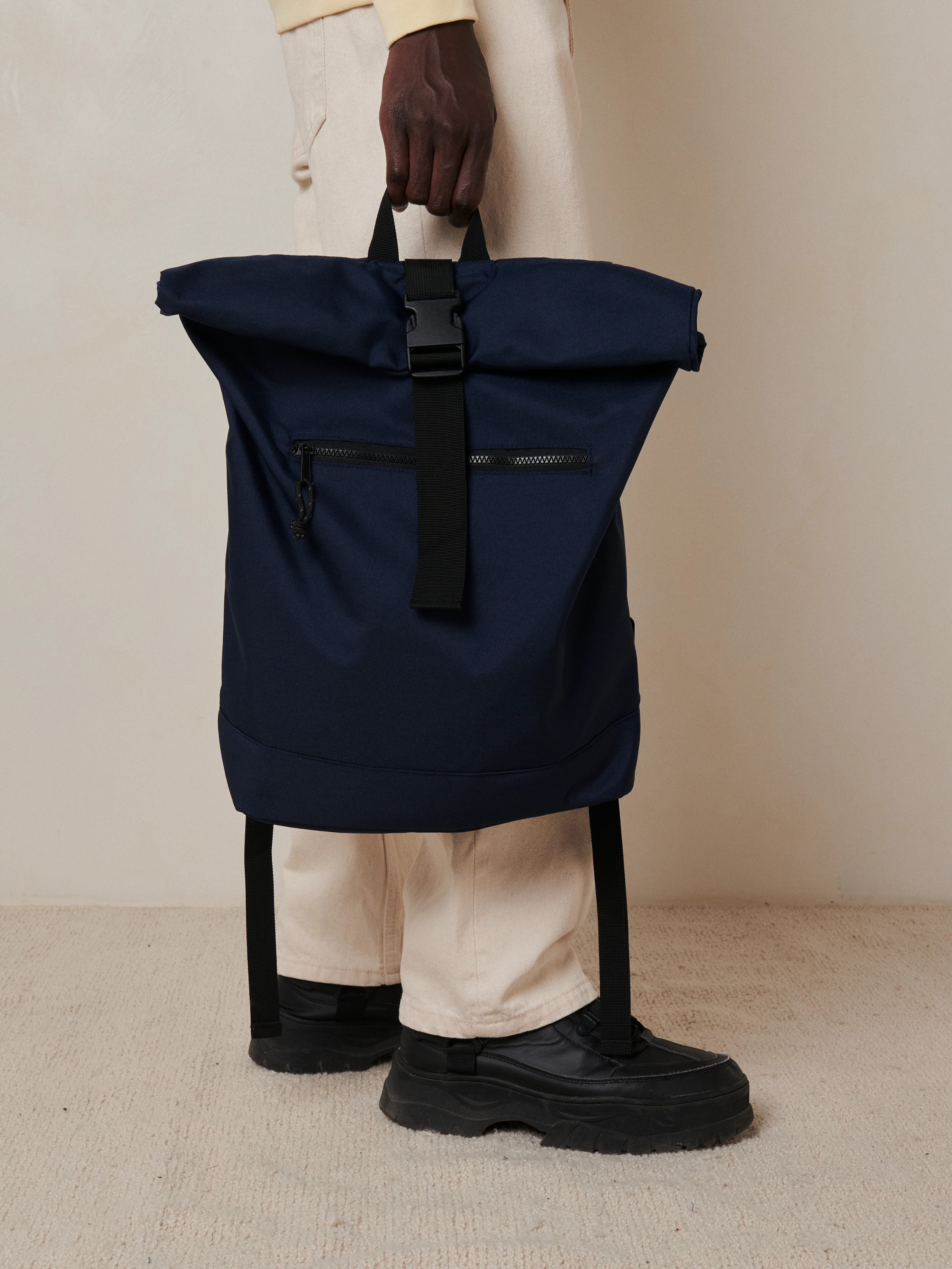 An eco-friendly recycled-polyester backpack for everyday use, with a laptop compartment up to 15.6".