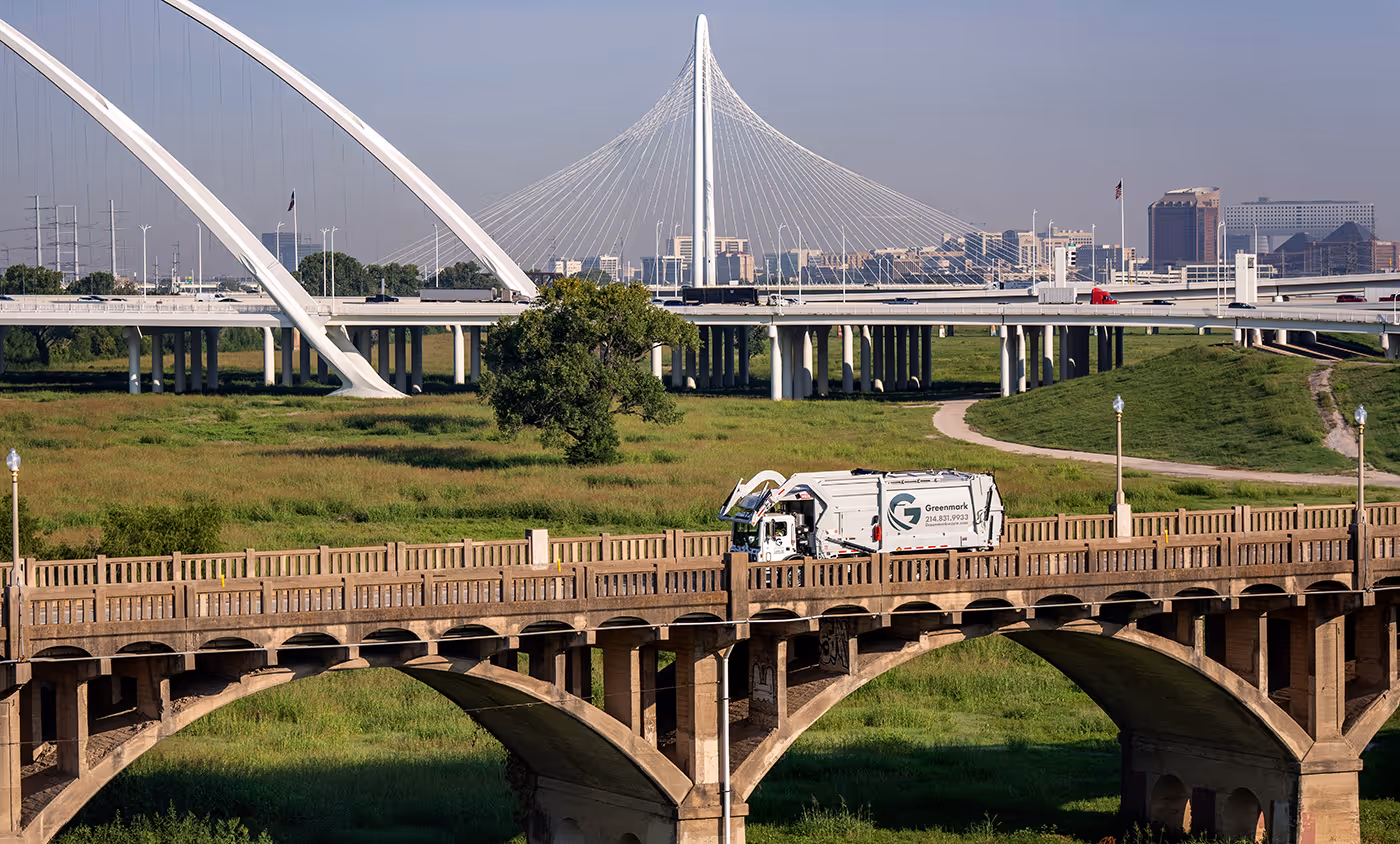 About Us Front Load Truck on Bridge
