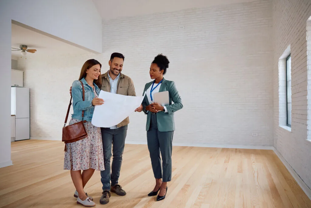 Real estate agent showng new home to buyers