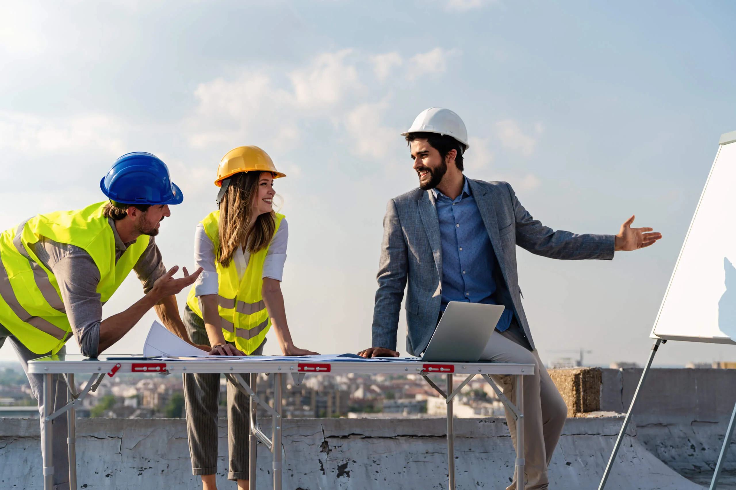 Builders discussing how to attract home buyers to their new construction projects,
