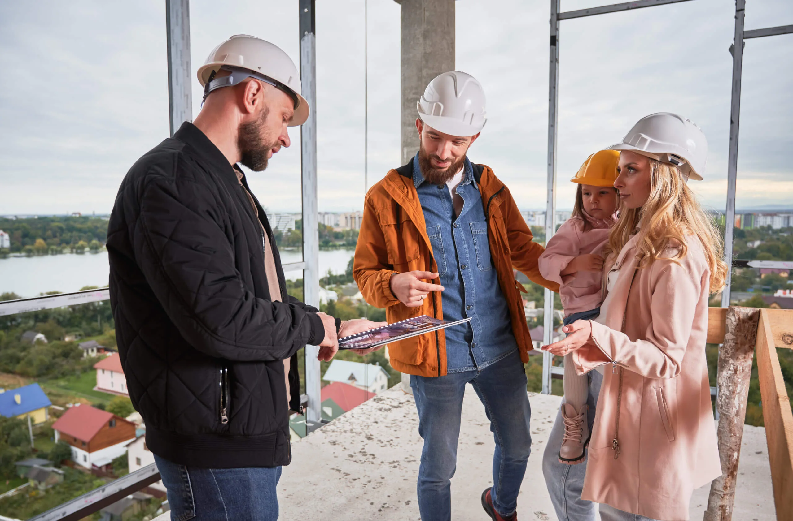 Builder showing the house to couple wiith child