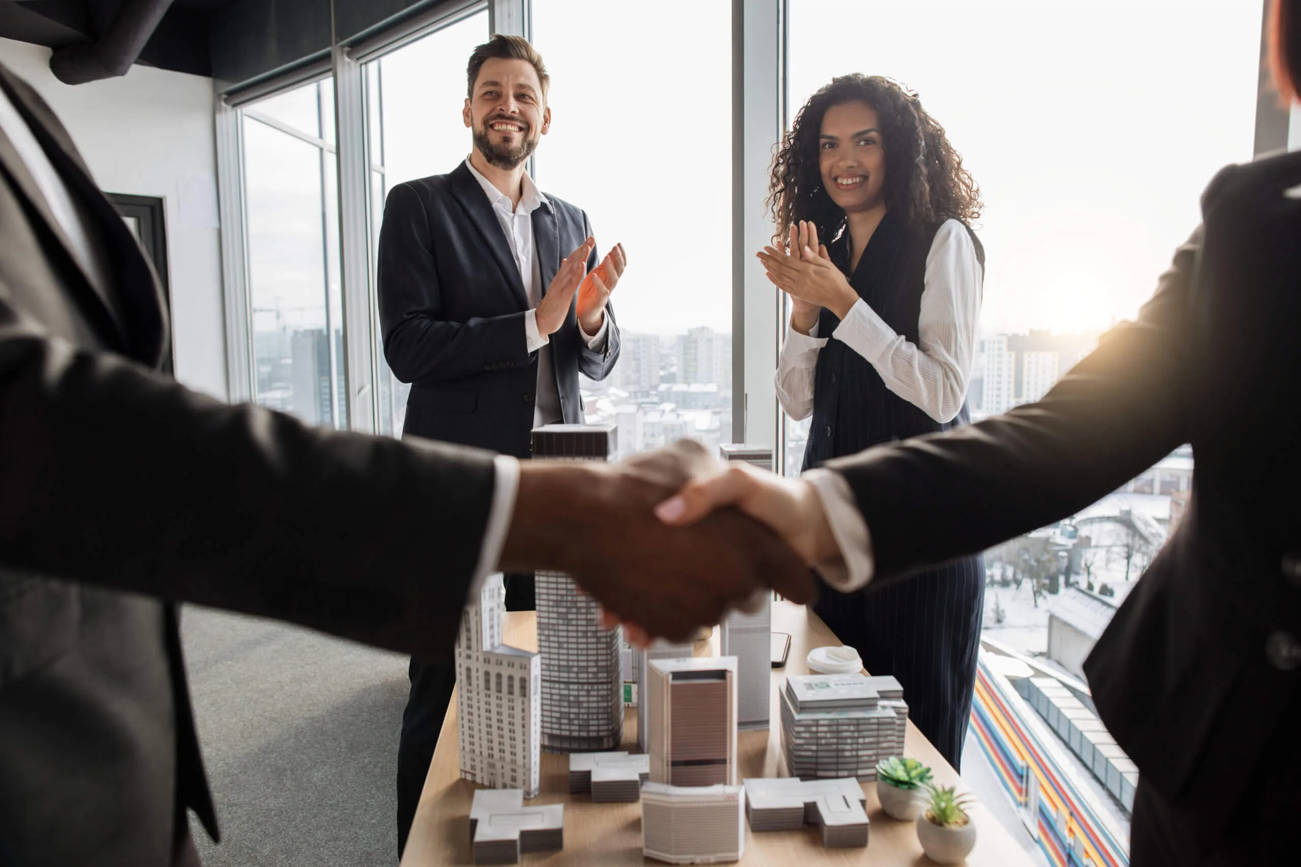 Lenders and buyers celebrating innovative mortgage solutions