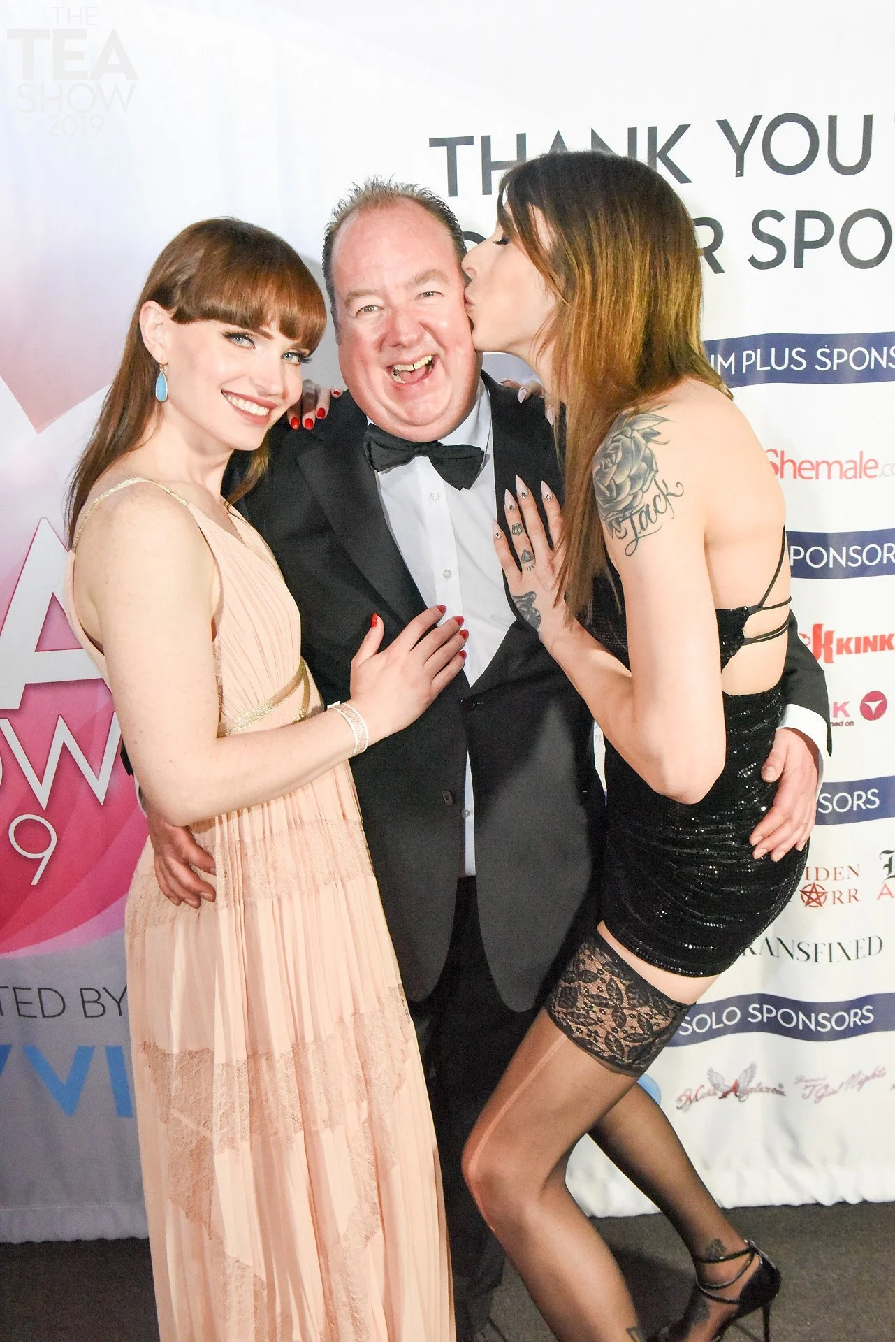  Steven Grooby, acclaimed CEO of Grooby Productions and host of the Trans Erotica Awards poses with superstar Natalie Mars and Casey Kisses 