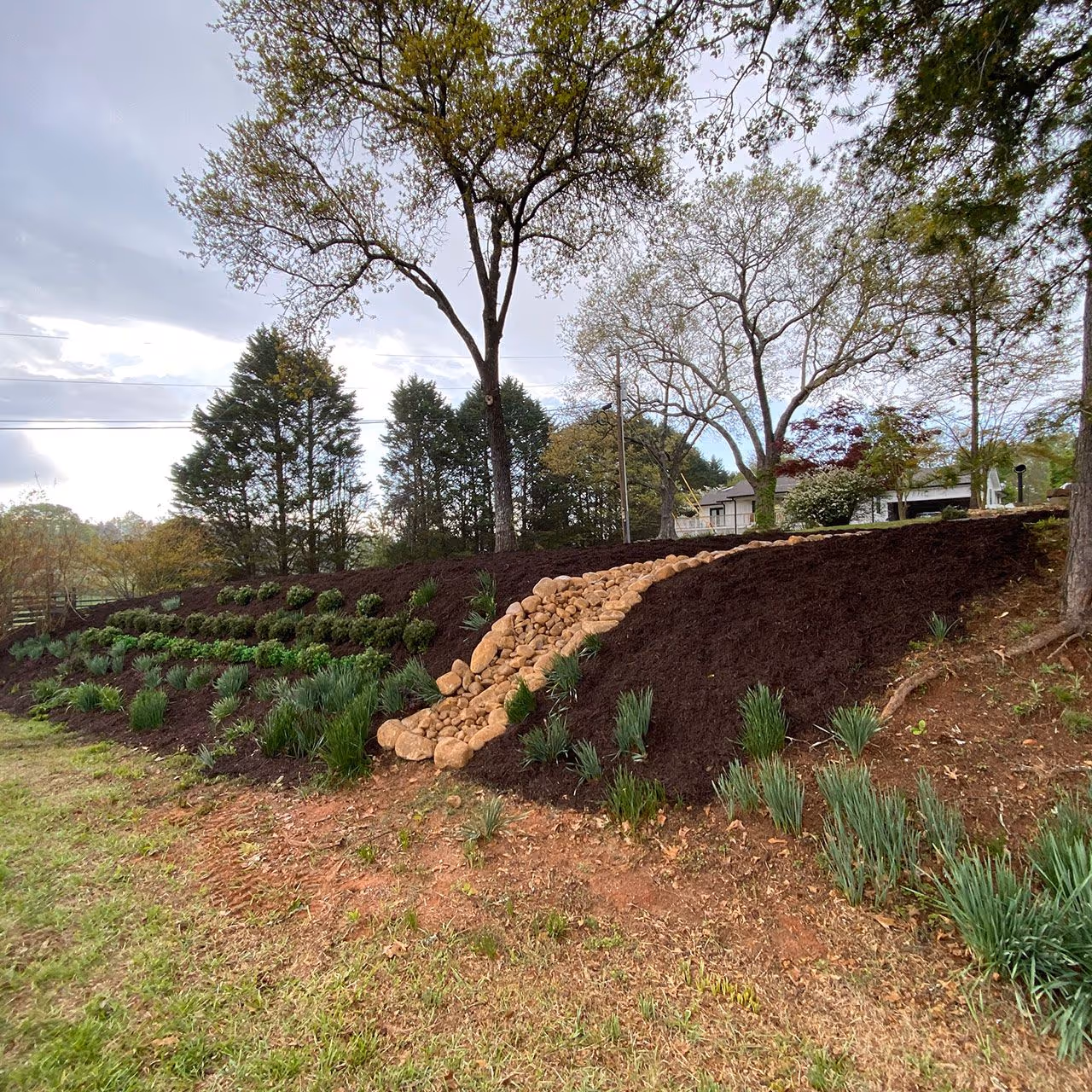 Dry creek bed water management solution by Georgia Pro Scapes