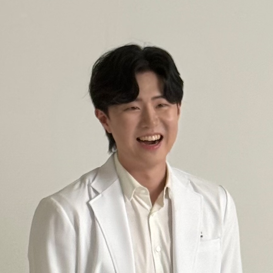 Dr.Han in his white coat. He is a founder of Reborn Seoul