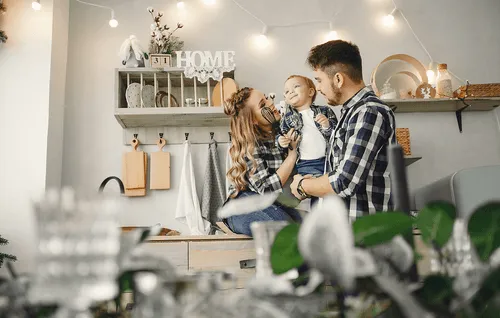happy family in a kitchen with lights
