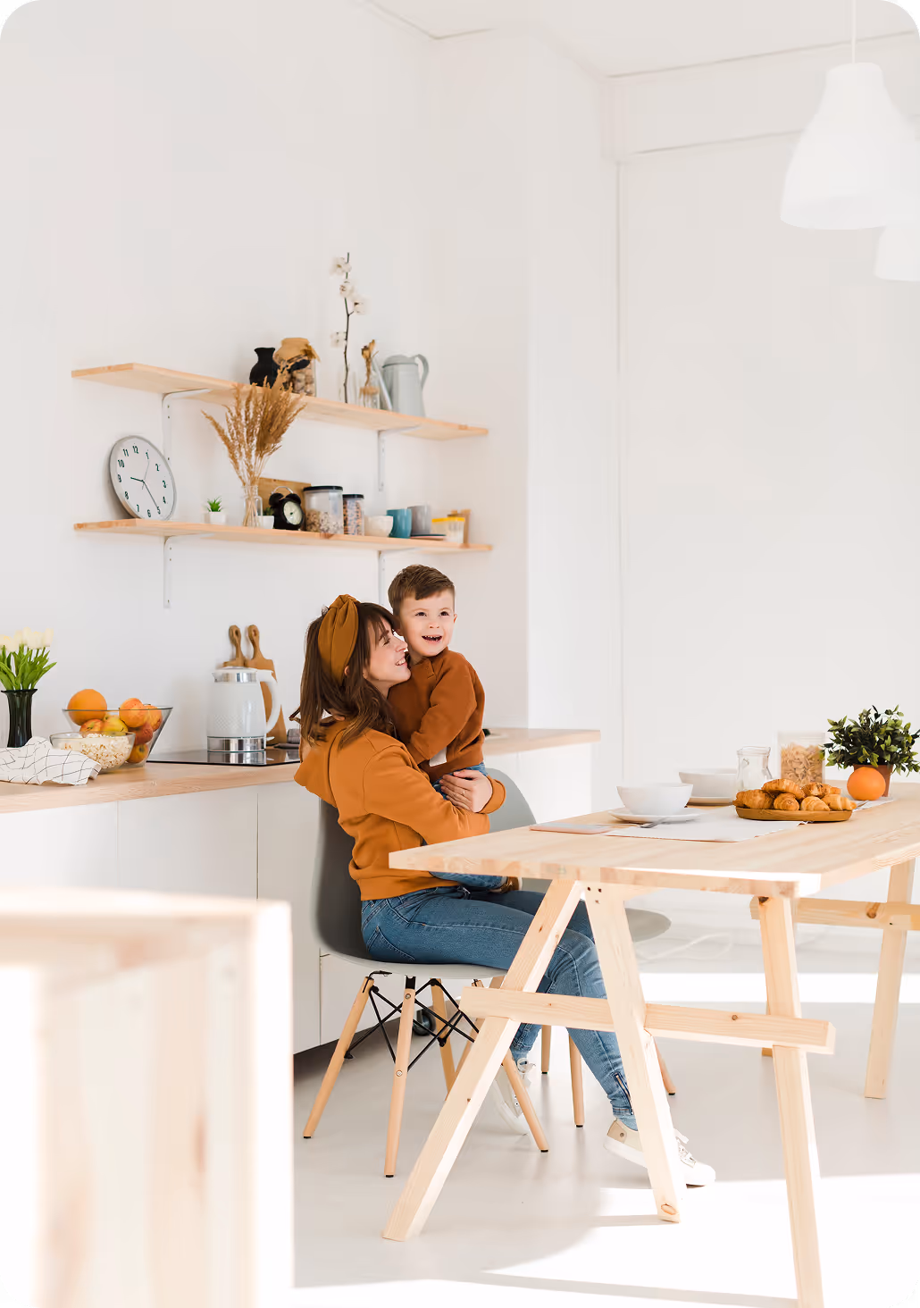 family that is happy in white kitchen
