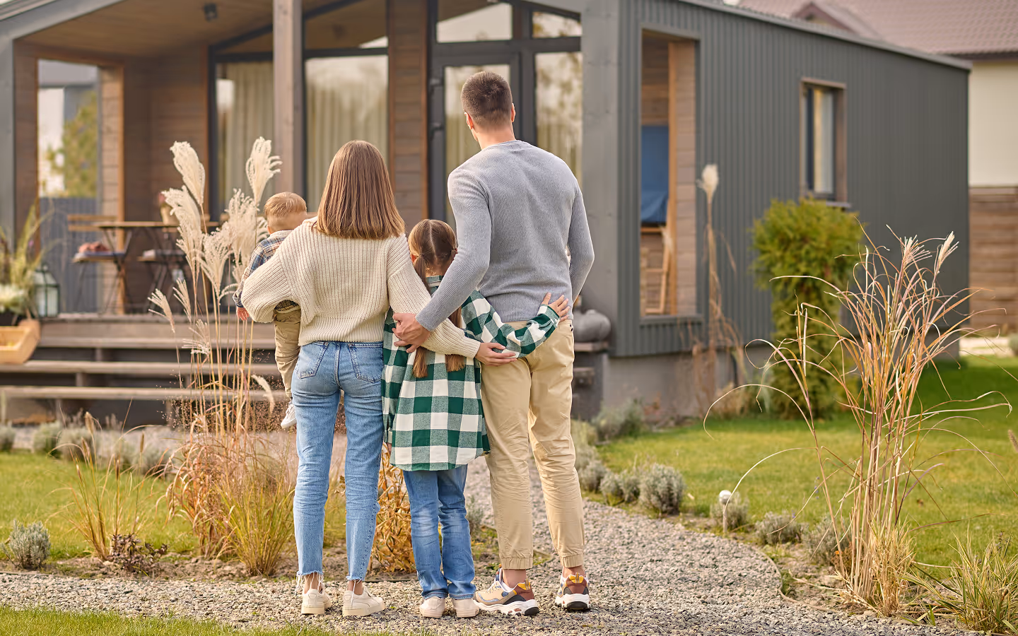family looking at their home that has been treated