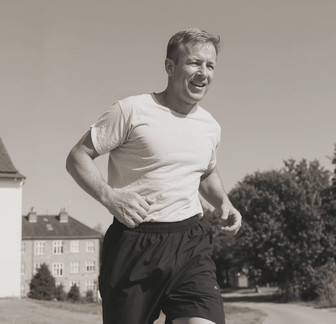 Person Jogginh Outdoors Smiling | The HRT Club