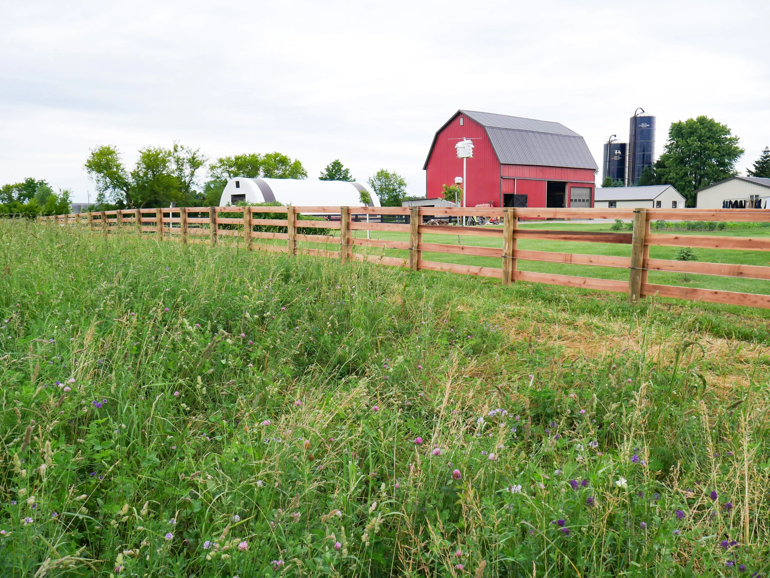 wooden pasture fence and barn in Michigan