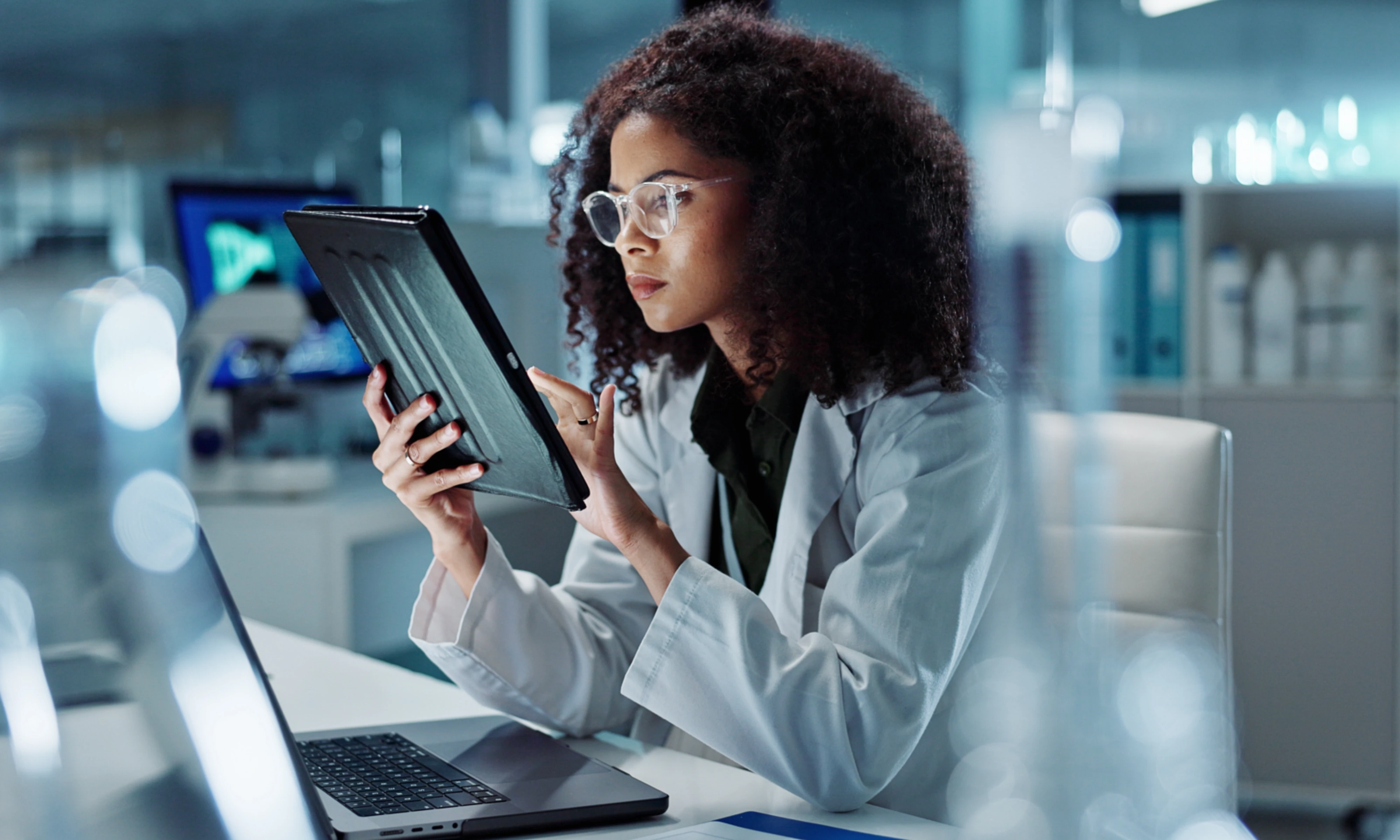 scientist looking at tablet