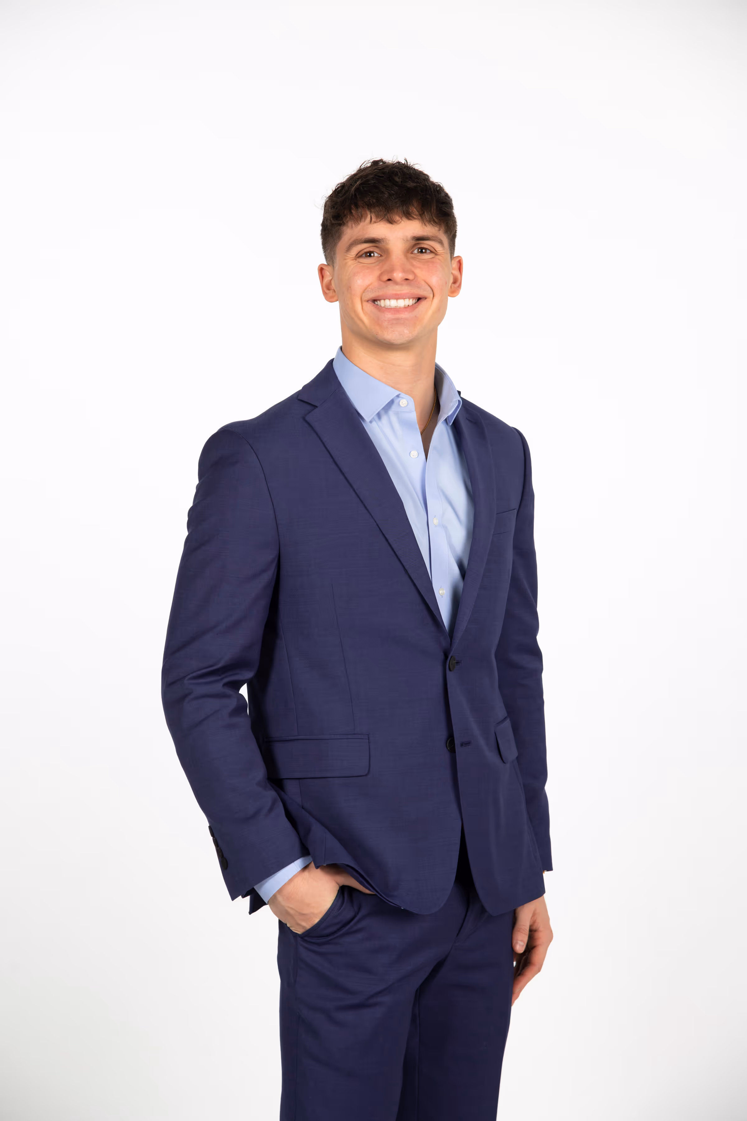 Football player in a purple and white uniform with number 6, on the field during a game.