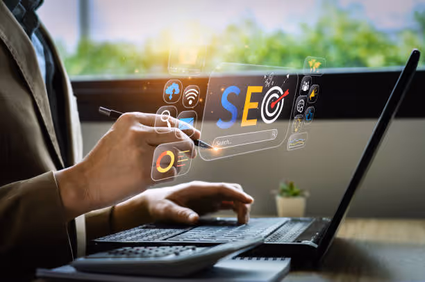 Person using a laptop with digital SEO icons and search interface floating above the keyboard.