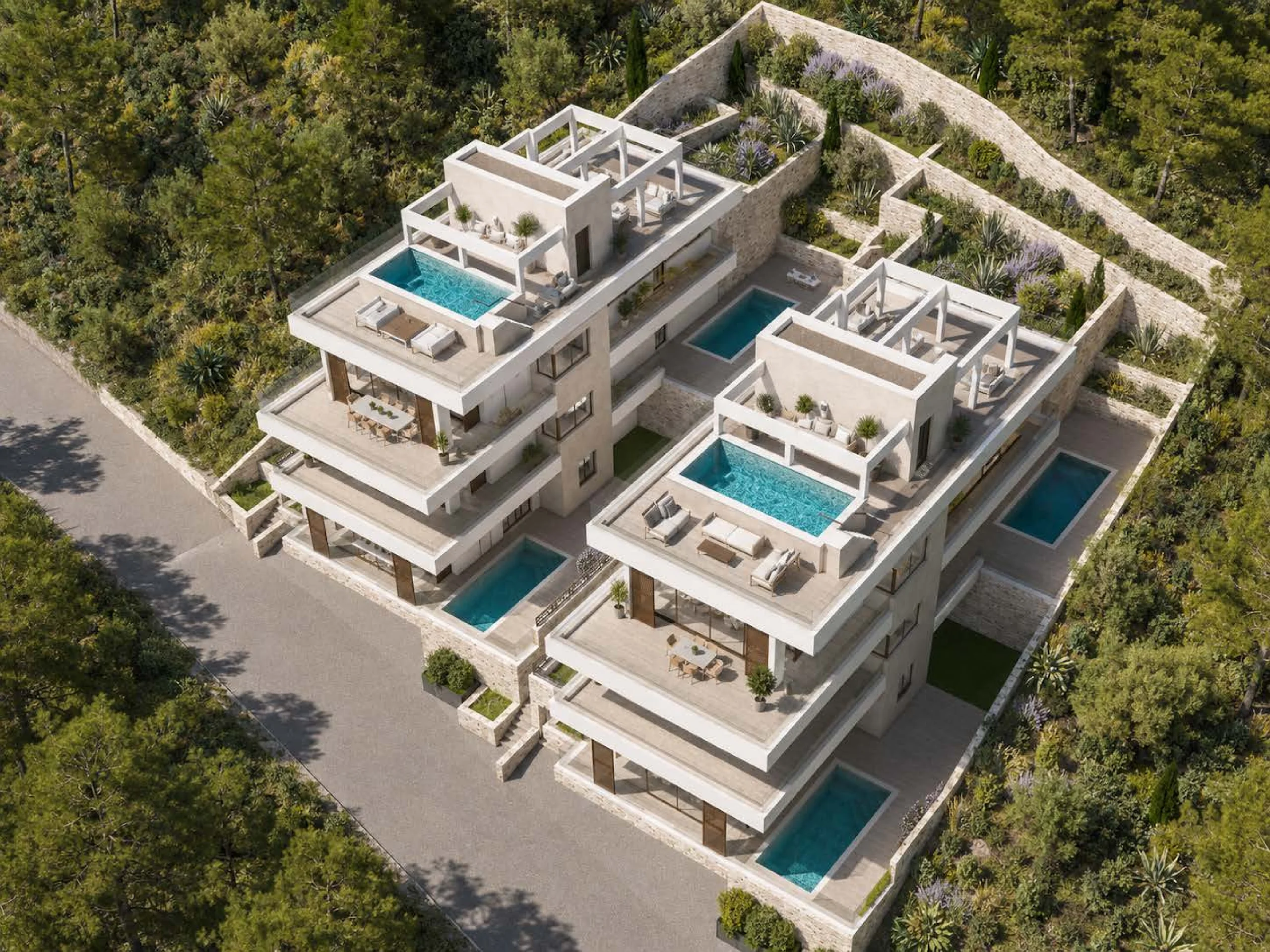 Aerial daytime view of modern white villa-style apartments with rooftop pools and surrounding greenery