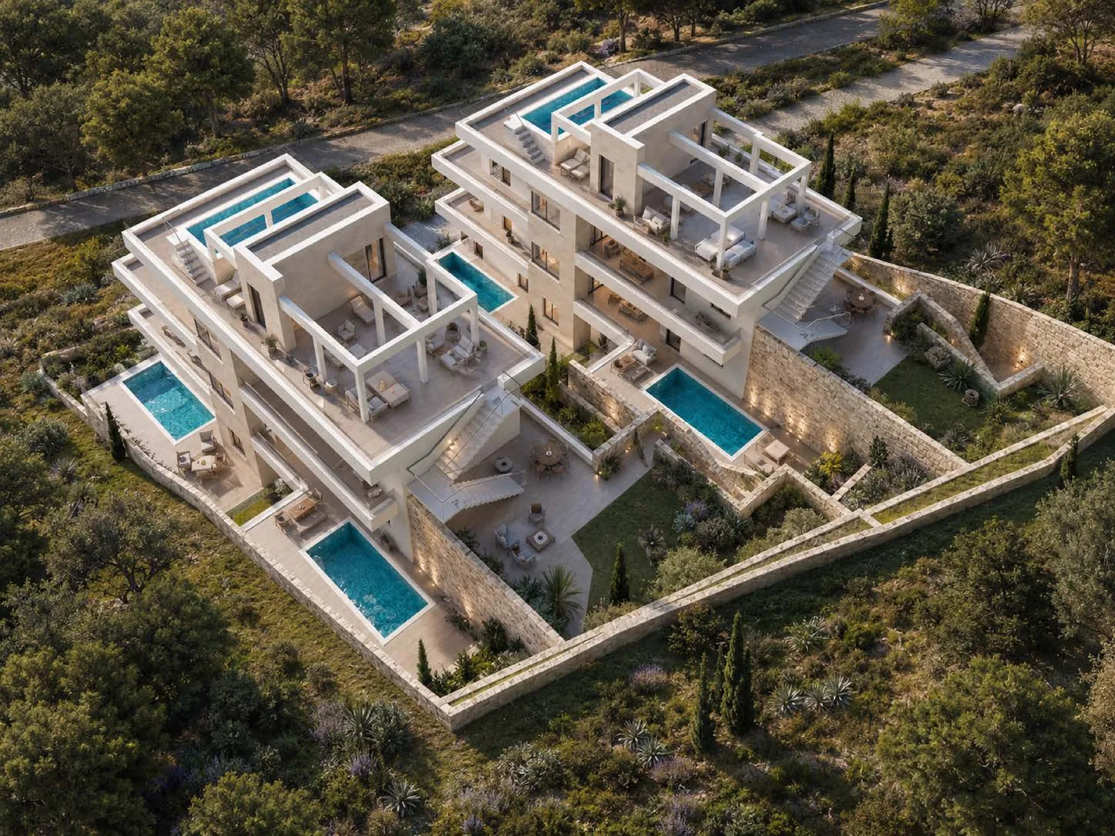 Top-down aerial view of multi-building residential complex with courtyards and pool areas