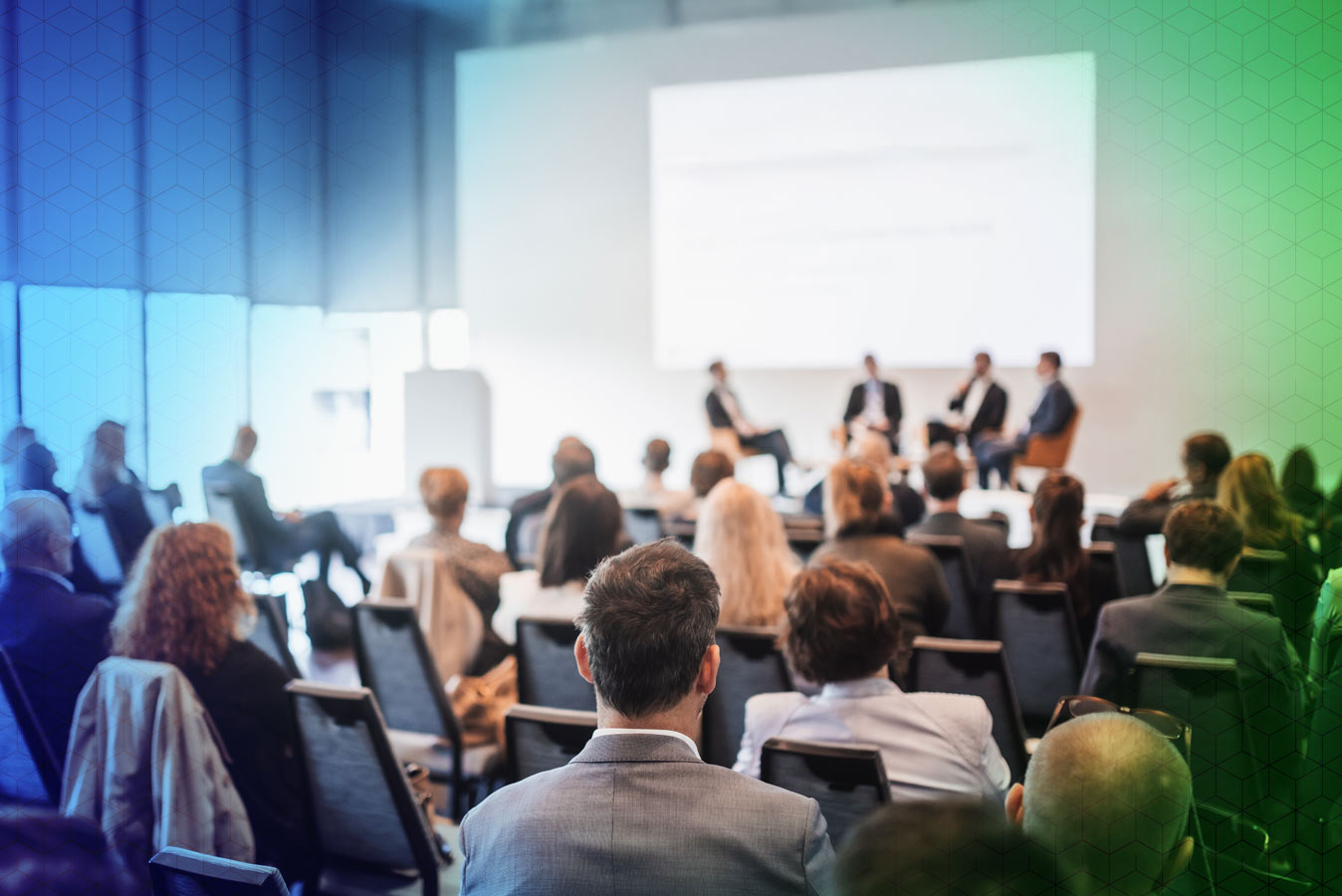 People on stage at a conference