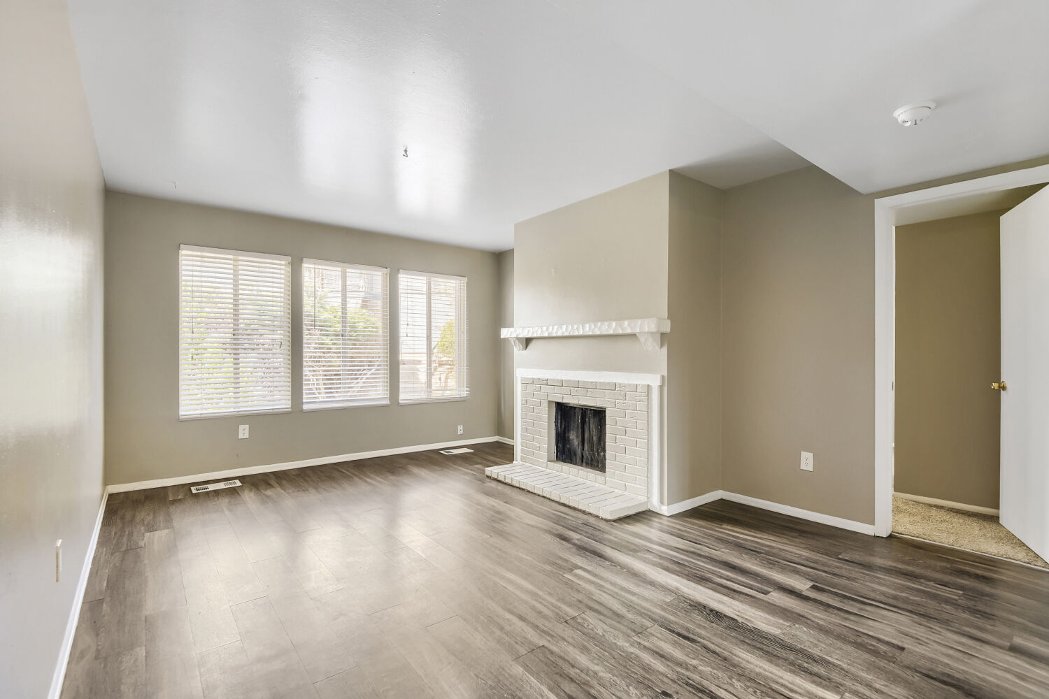 Kitchen with white cabinets and black appliances