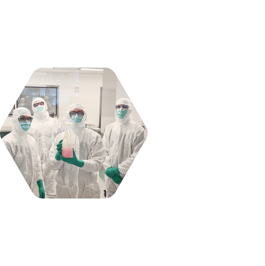 a group of scientists posing for a selfie in the lab