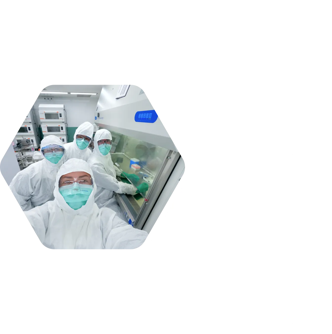 a group of scientists posing for a selfie in the lab