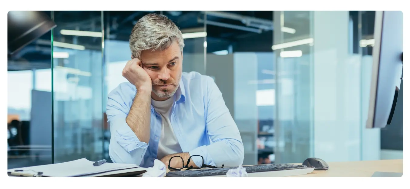 Image of an actively disengaged employee feeling burnt out.