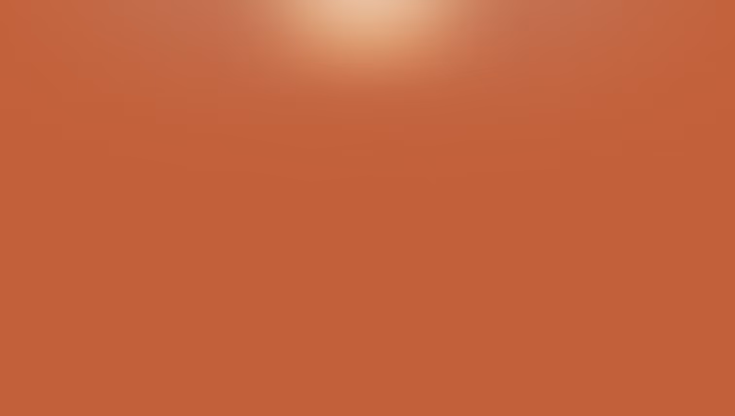 Blurry orange background with a bright circular light spot near the top center.