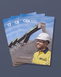Brochure cover showing a smiling worker in a yellow jacket and white hard hat with industrial conveyor belts in the background.