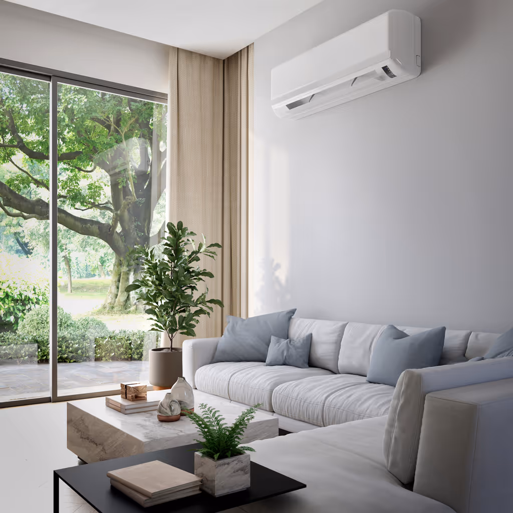 Modern living room with white sectional sofa, blue pillows, potted plants, and large glass window showing green trees outside.