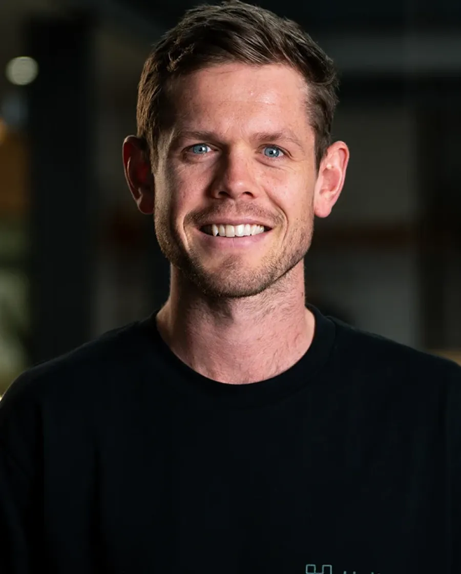 A portrait of Toby, who is a Halter team member.