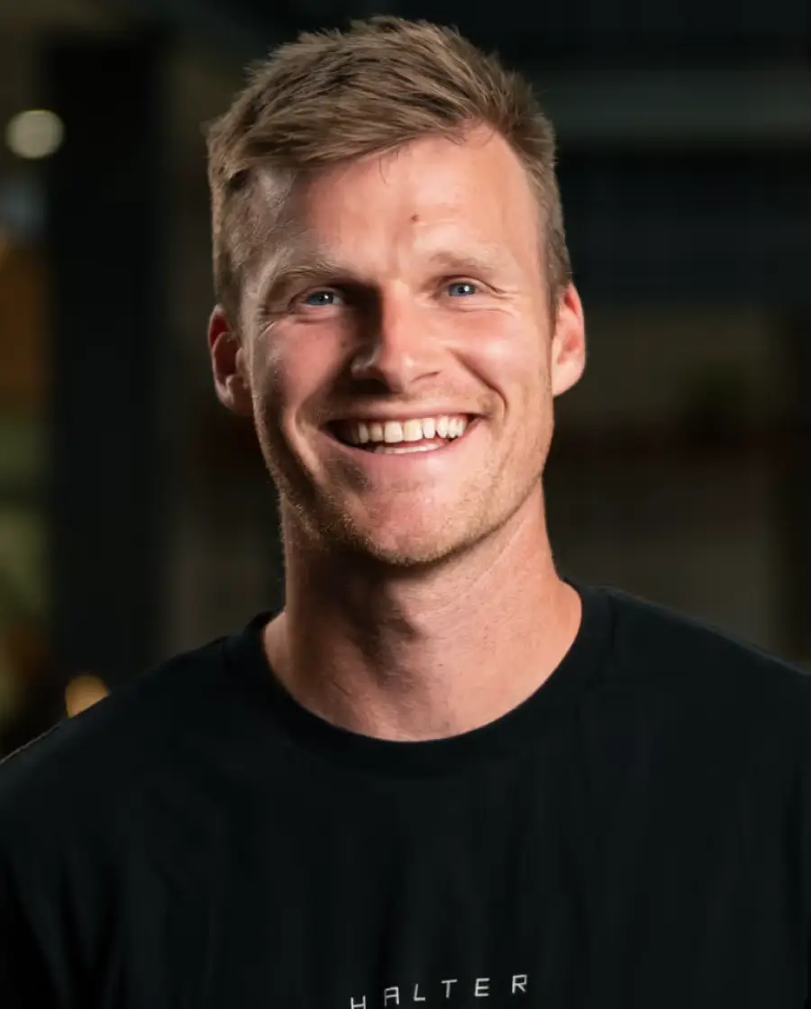 Craig Piggott — a man with short light brown hair and fair skin, wearing a black Halter shirt.