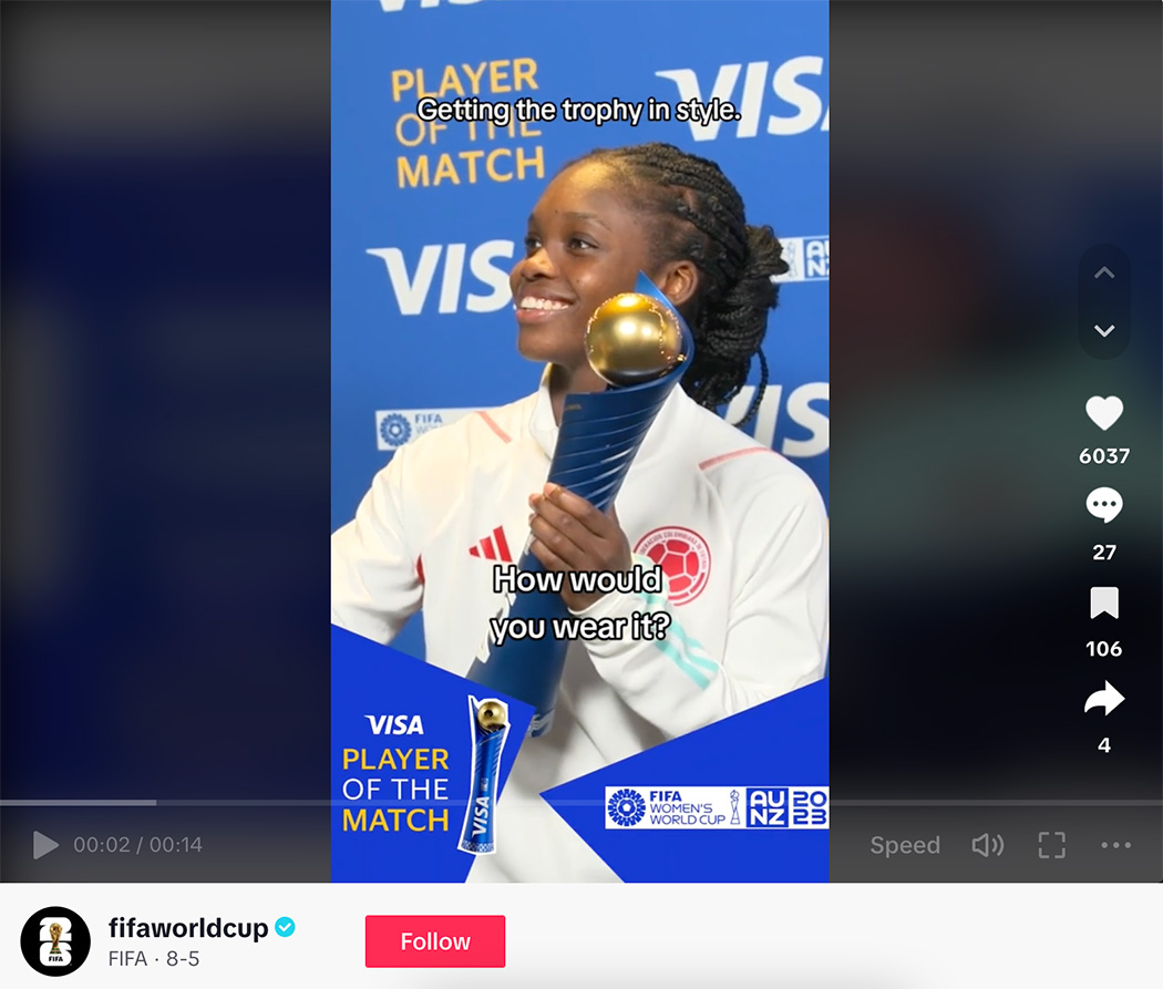 Screenshot of FIFA womens world cup player holding the trophy