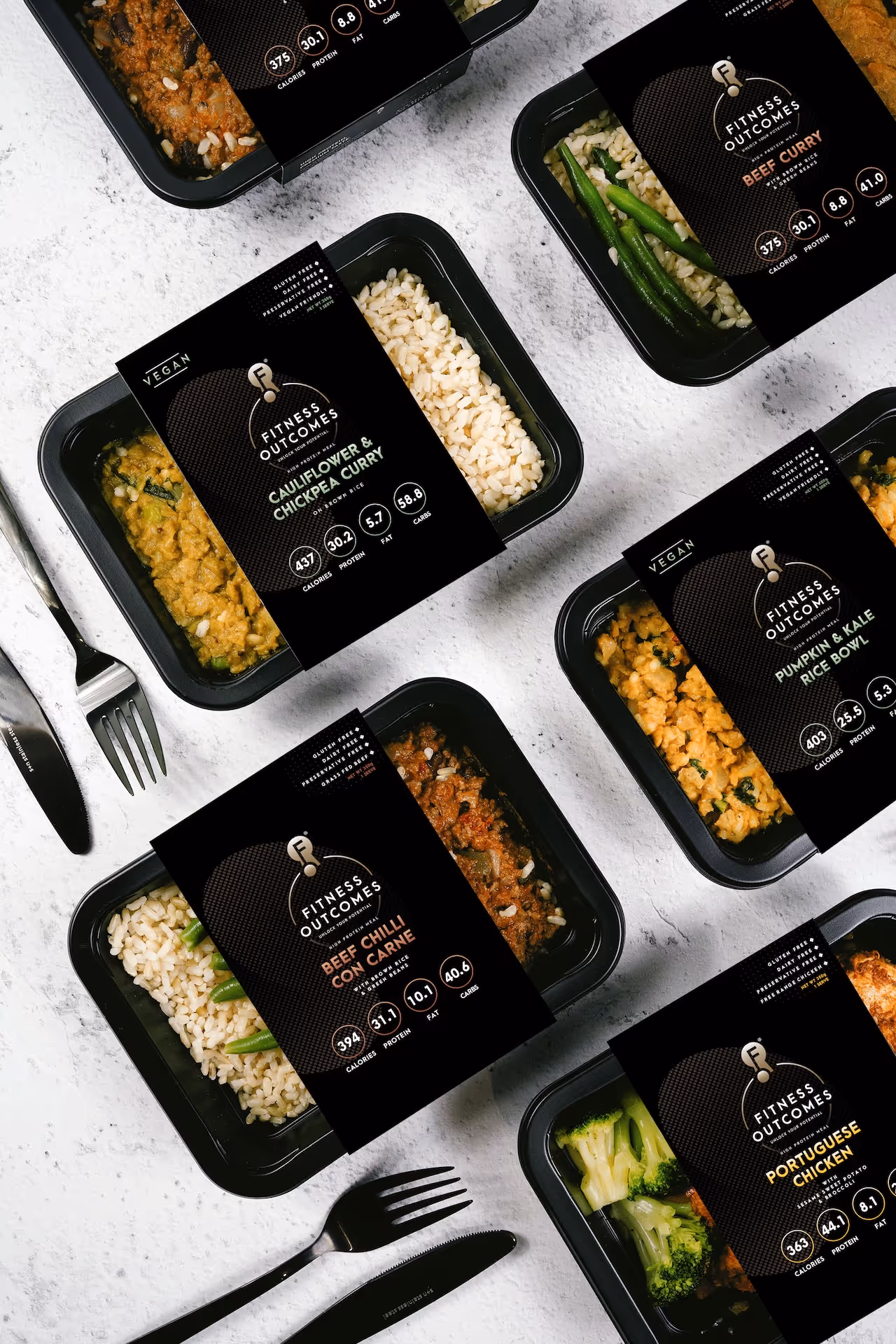 Packaging design for Fitness Outcomes ready meals, showing retail packaging sleeve artwork and product branding. Designed by Spacey Studios.