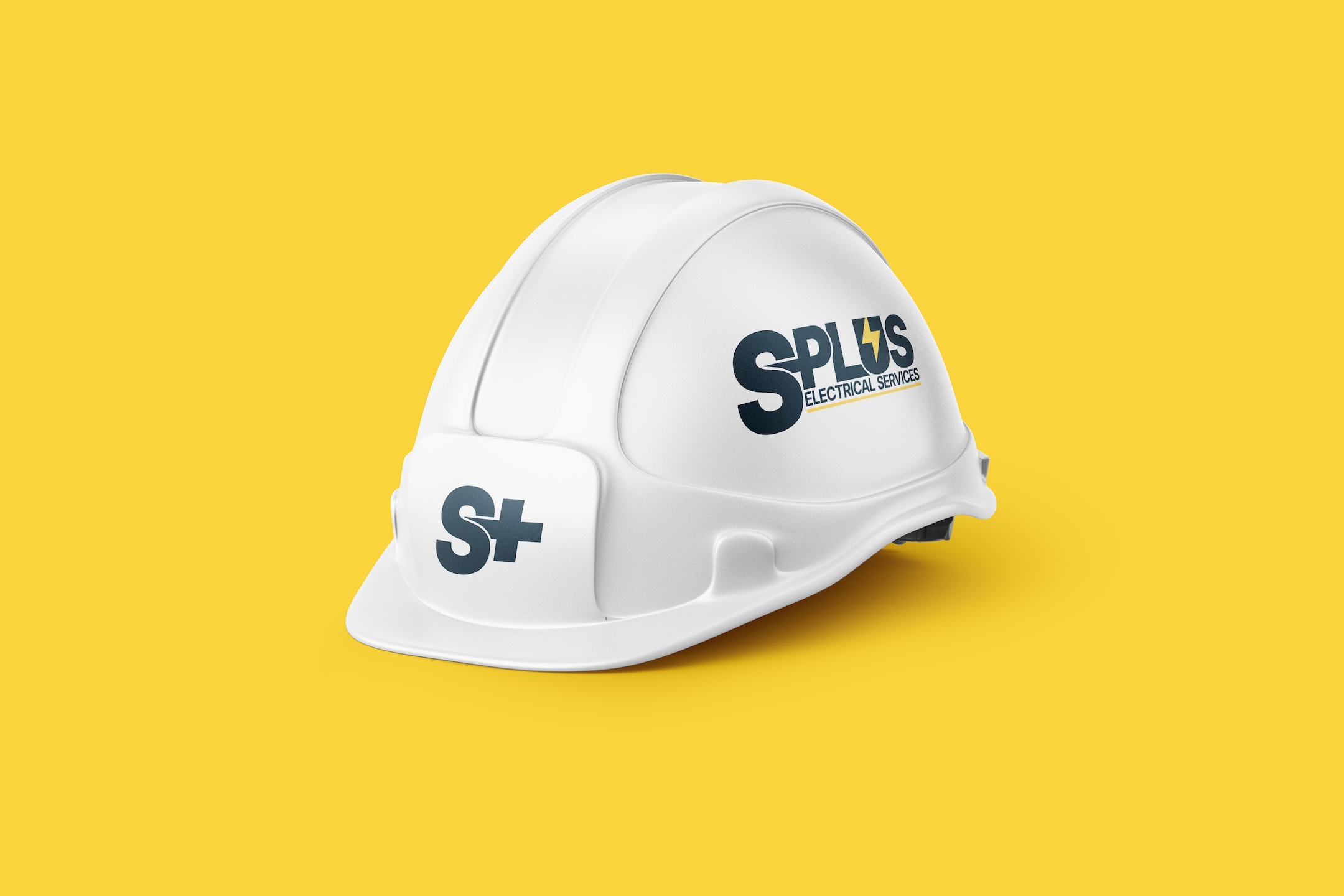 S-Plus Electrical Services Brand Identity on a construction hardhat helmet, designed by Spacey Studios.
