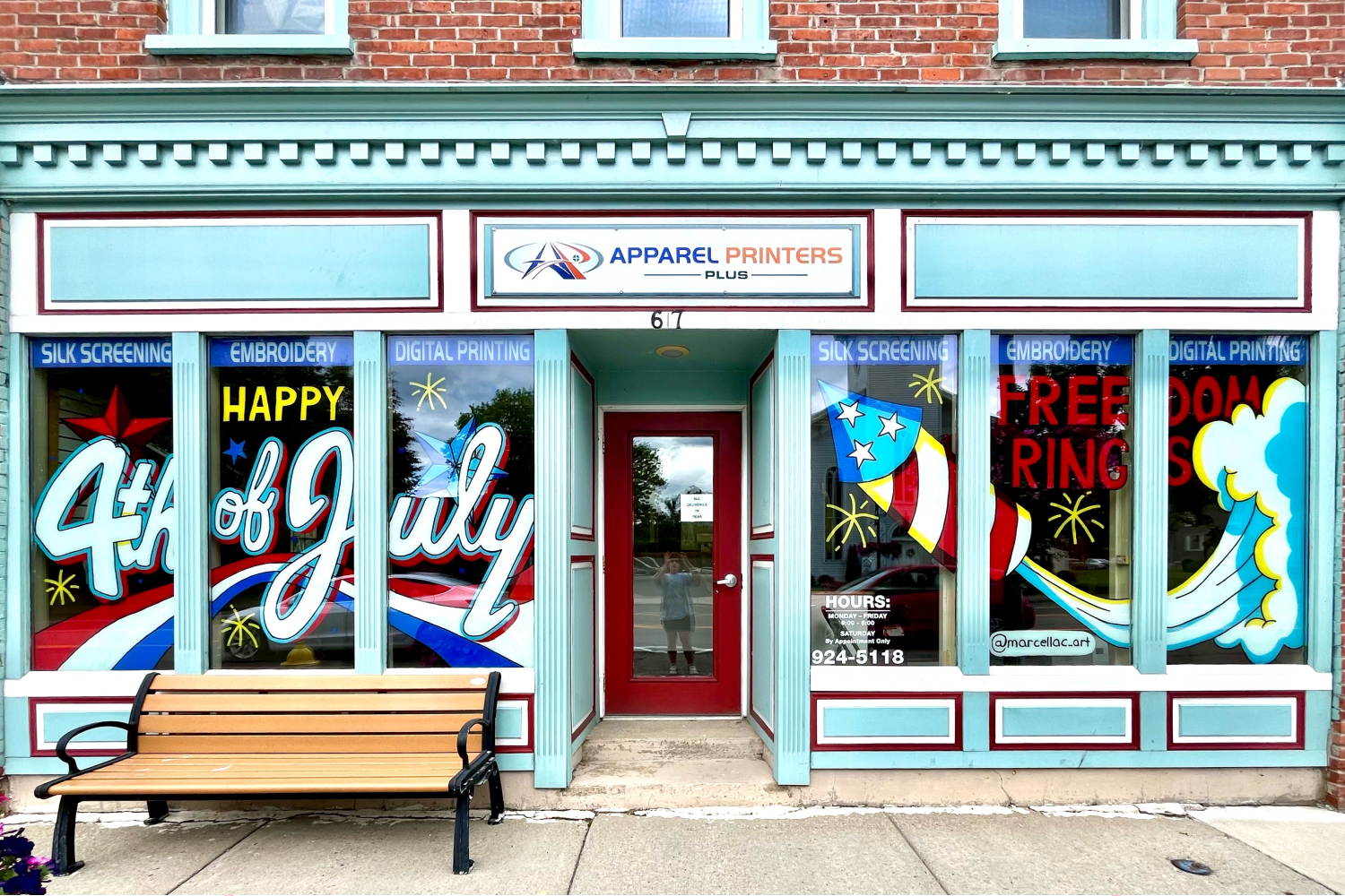 (Left Window) Window with stars, red, white, and bule stripes, and the words "Happy 4th of July" painted in white cursive letters. (Right Window) Firework is being launched with a trail of smoke behind, red text that says "Freedom Rings".