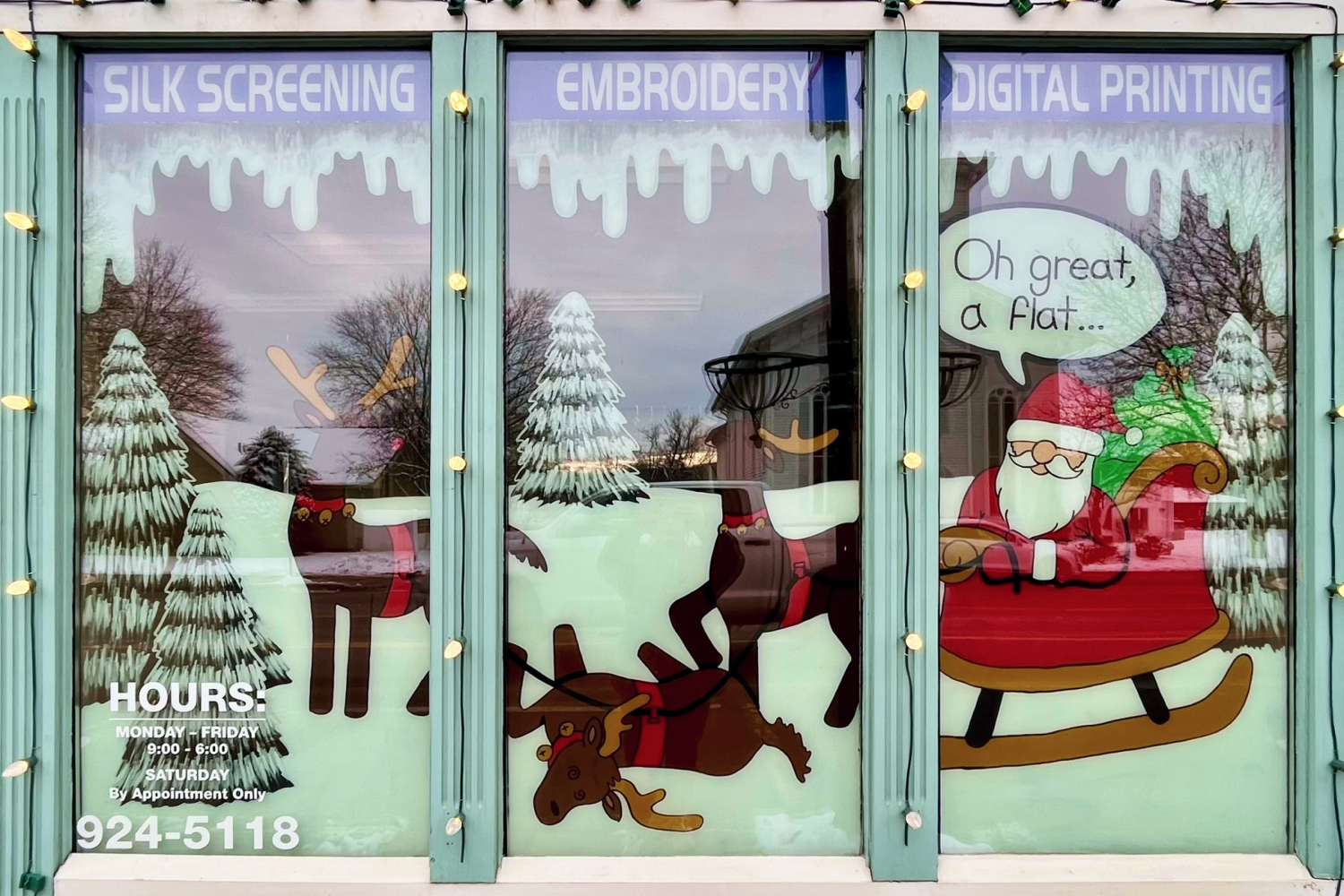 Three reindeer, one has fallen over, withe Santa in his sleigh saying "Oh great, a flat".