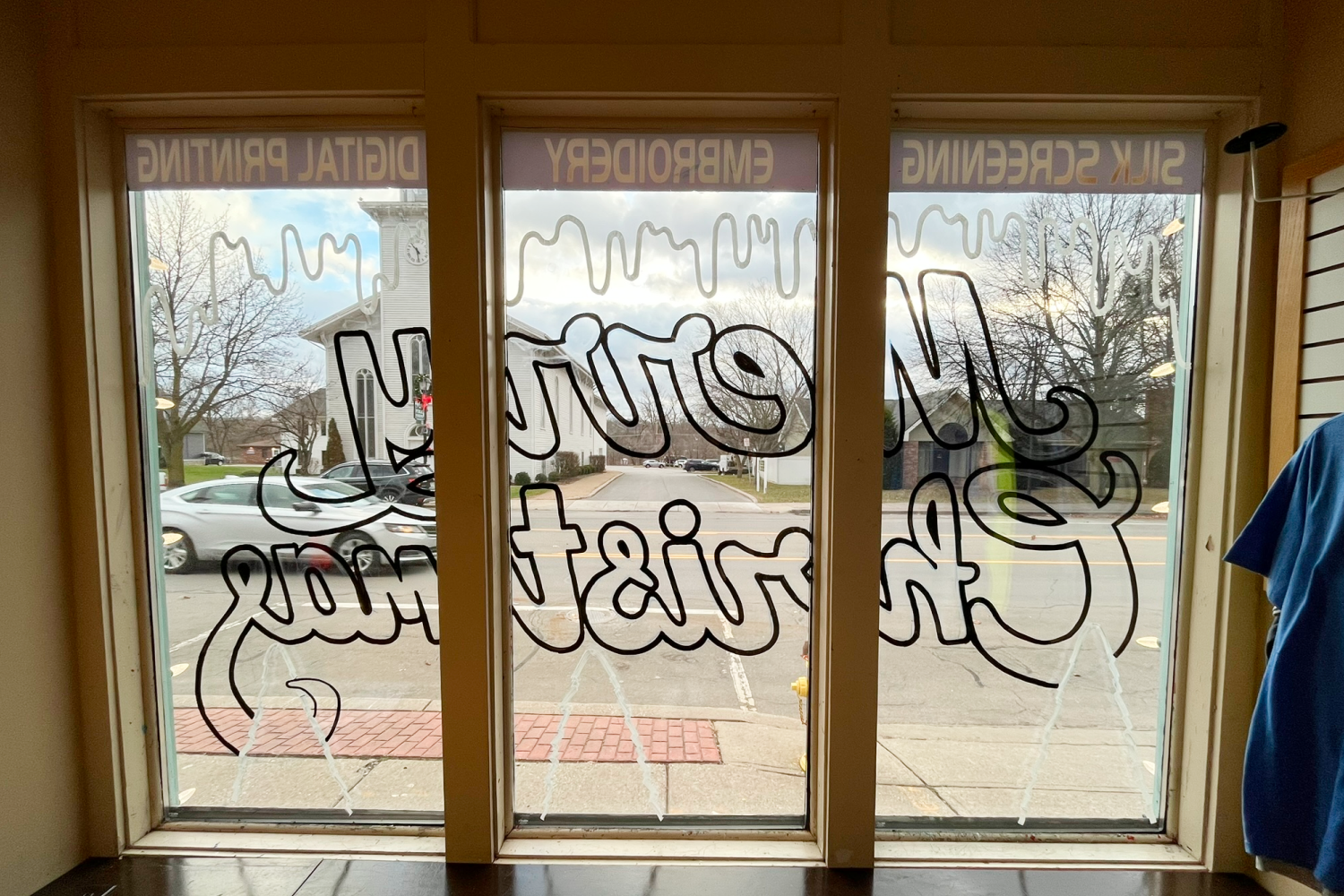 Merry Christmas outlined in black, no colored paint.