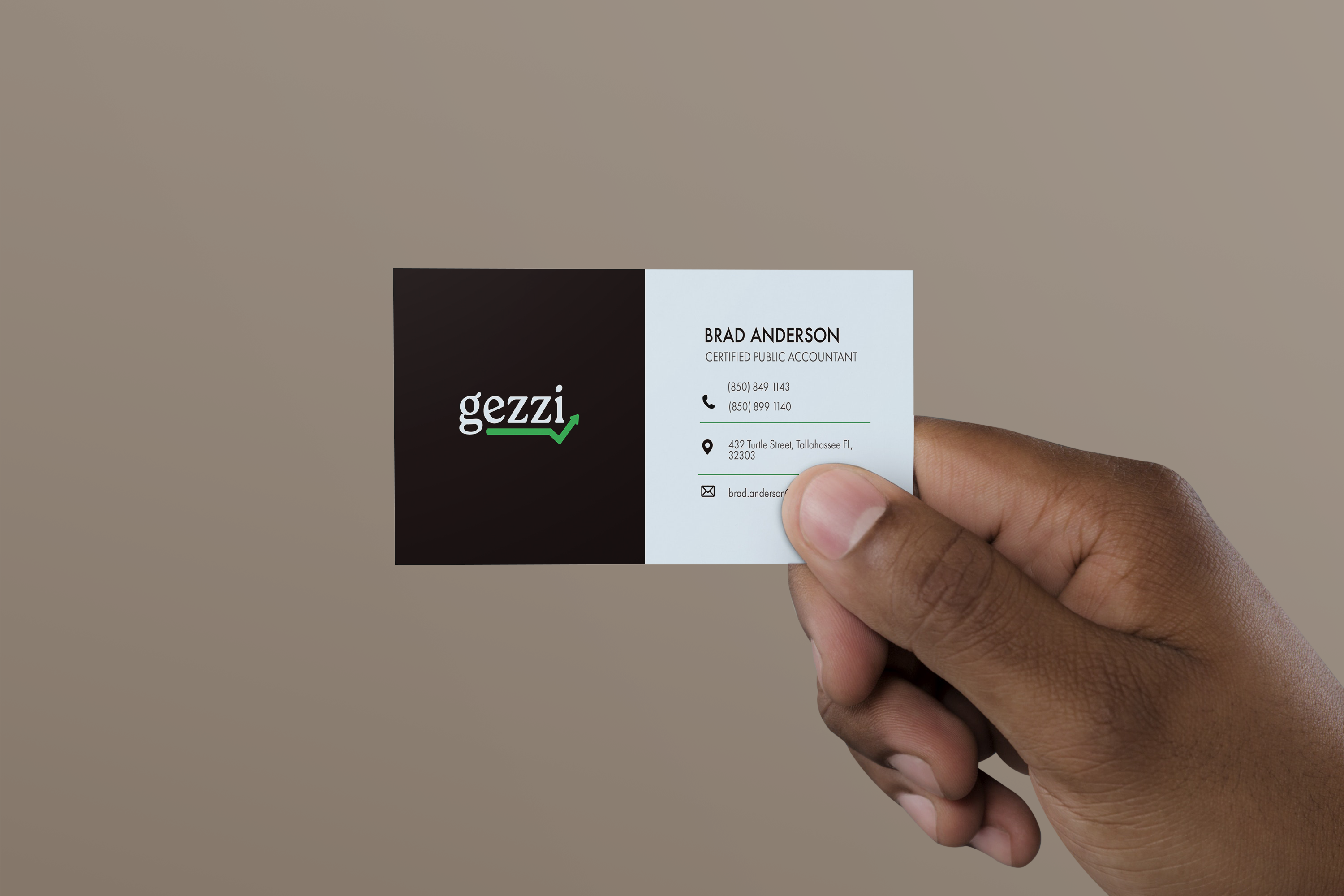 Hand holding a business card for Brad Anderson, Certified Public Accountant at Gezzi, with contact details.
