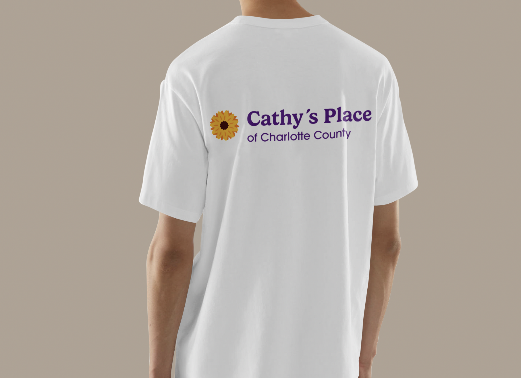 White shopping bag with brown handles featuring a yellow bird logo and contact information below.