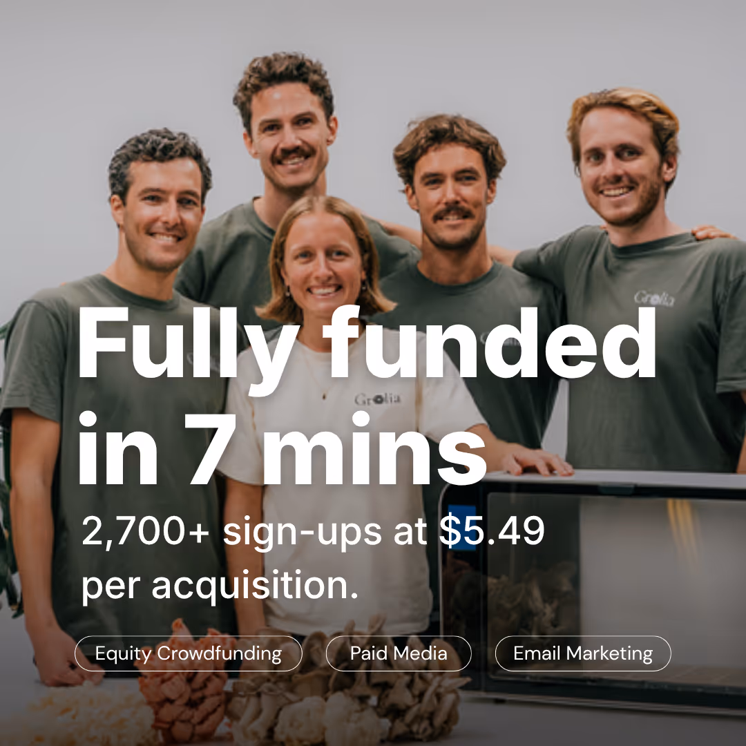 Five smiling people standing behind a table with text overlay about funding and sign-ups.