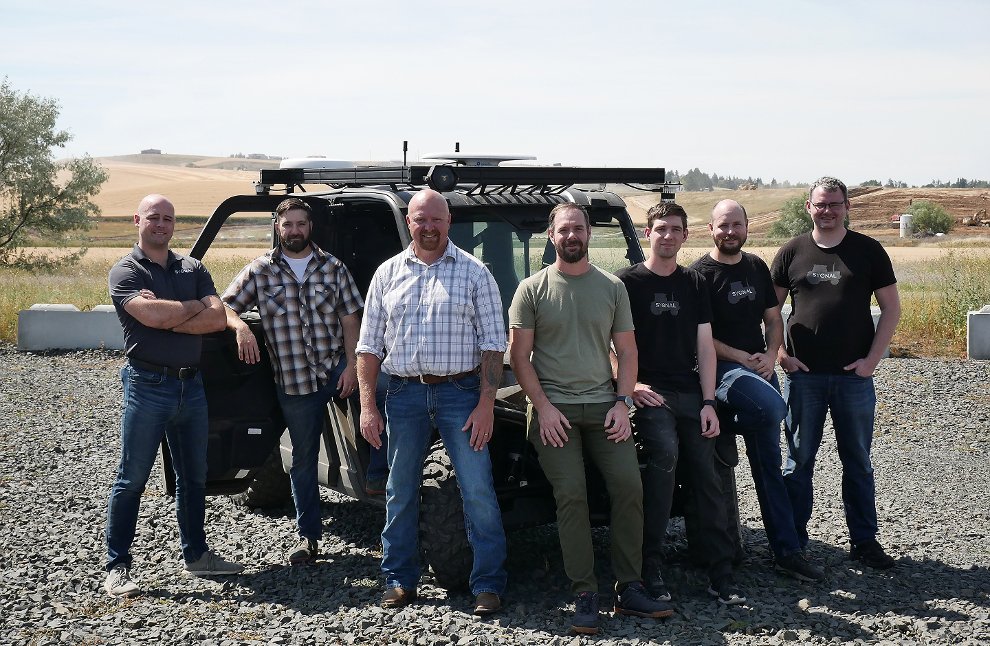Team in front of a Truck