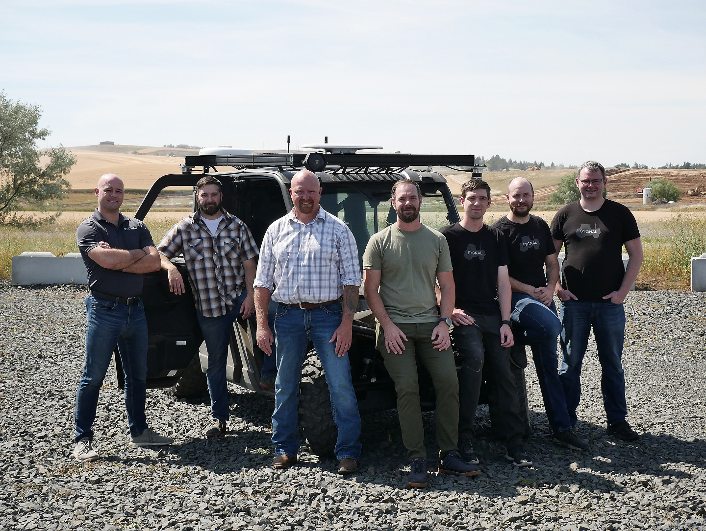 Team in front of a Truck