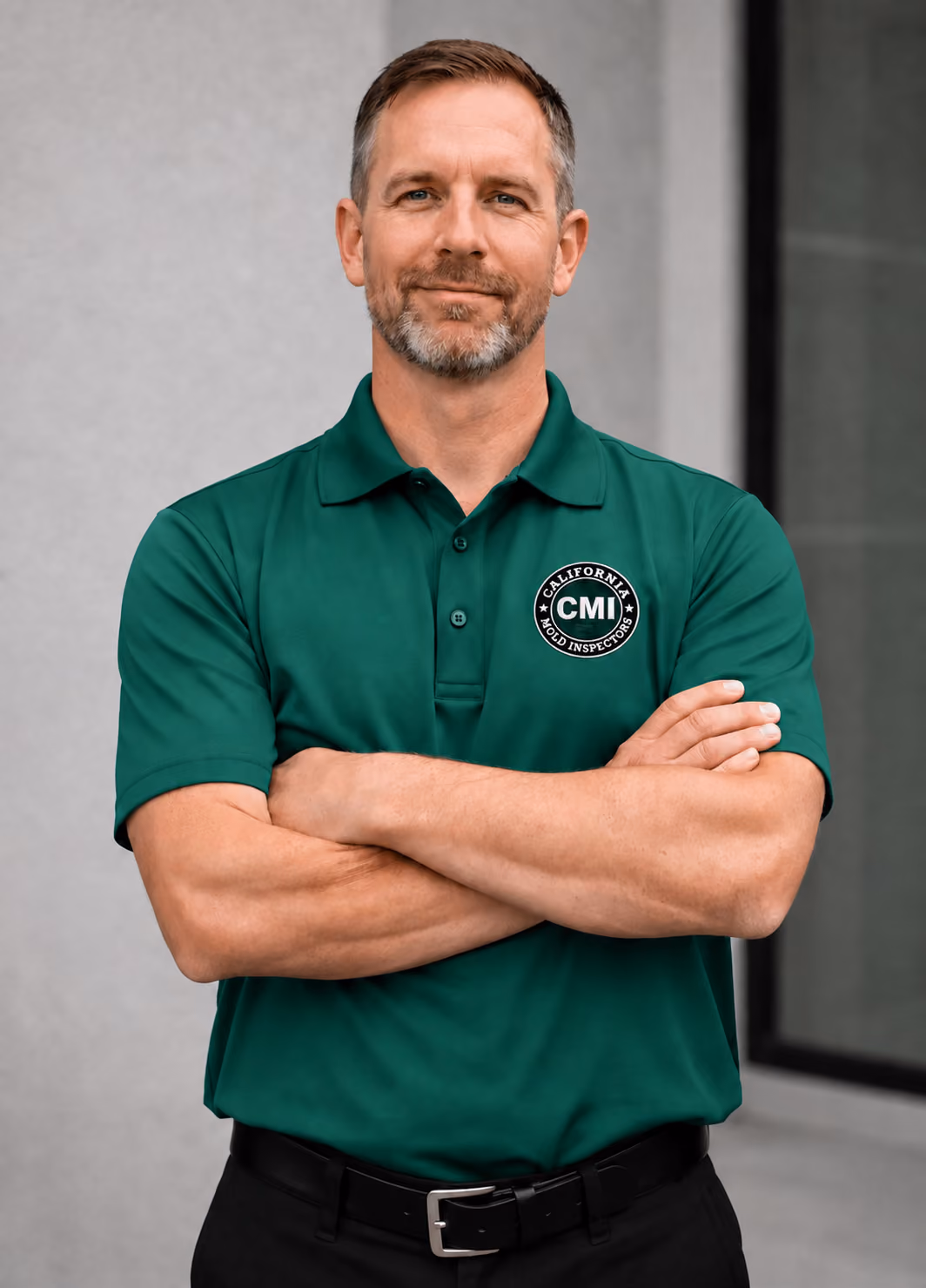 Three smiling team members wearing matching green CMI polo shirts with arms crossed.