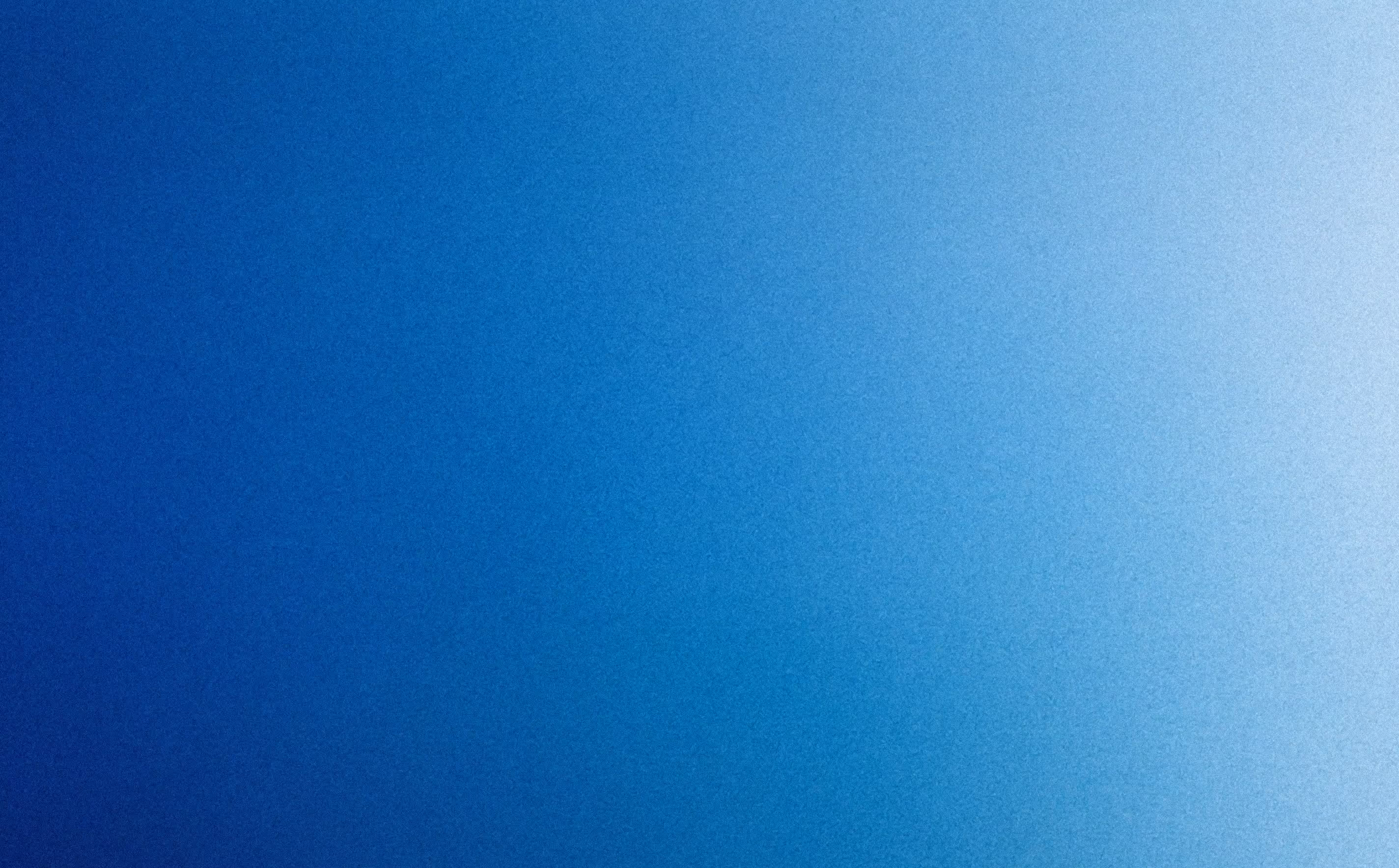 Smooth gradient background transitioning from dark blue on the left to light blue on the right.