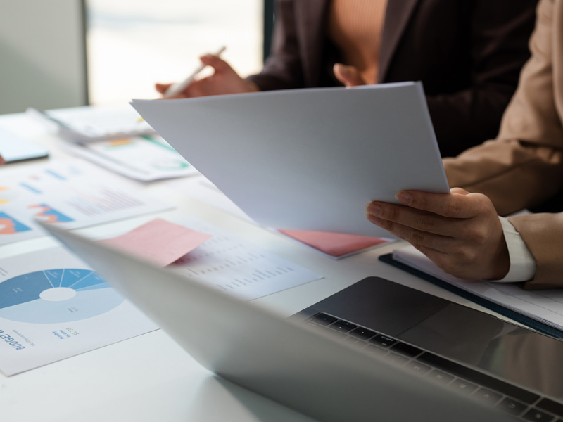 Investor reviewing documents for investing in solar energy projects through Brightwell