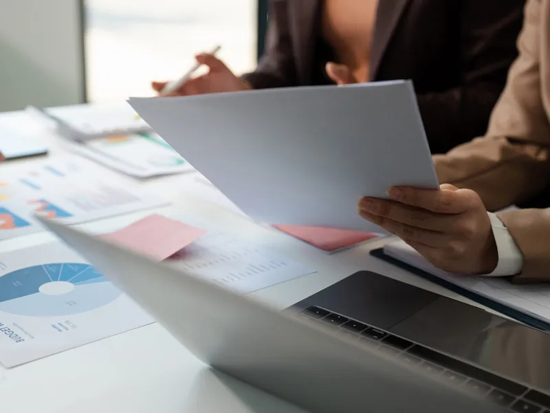 Investor reviewing documents for investing in solar energy projects through Brightwell