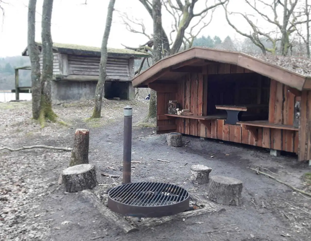 A shelter with a bonfire