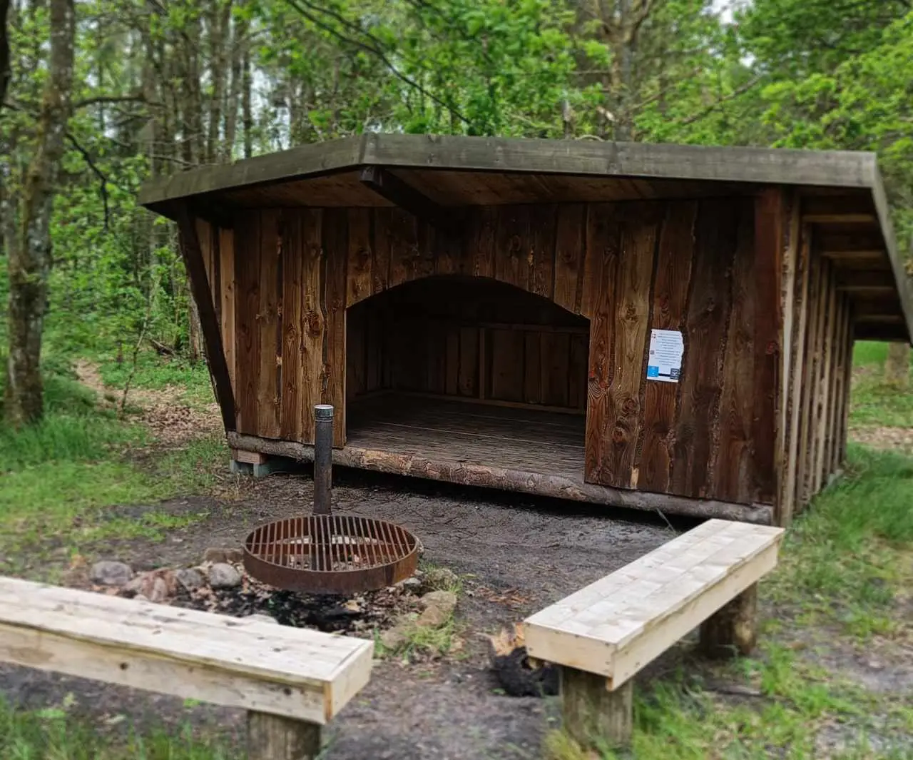 A shelter with a bonfire