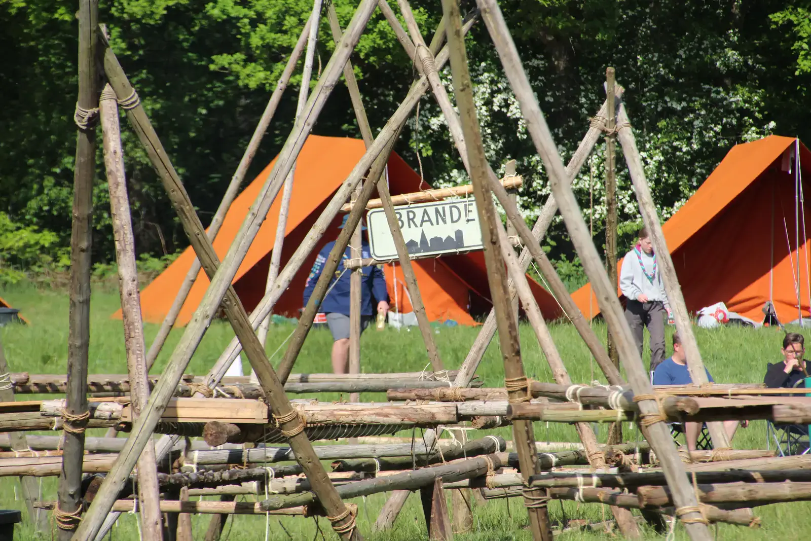 A wooden structure built on a campsite