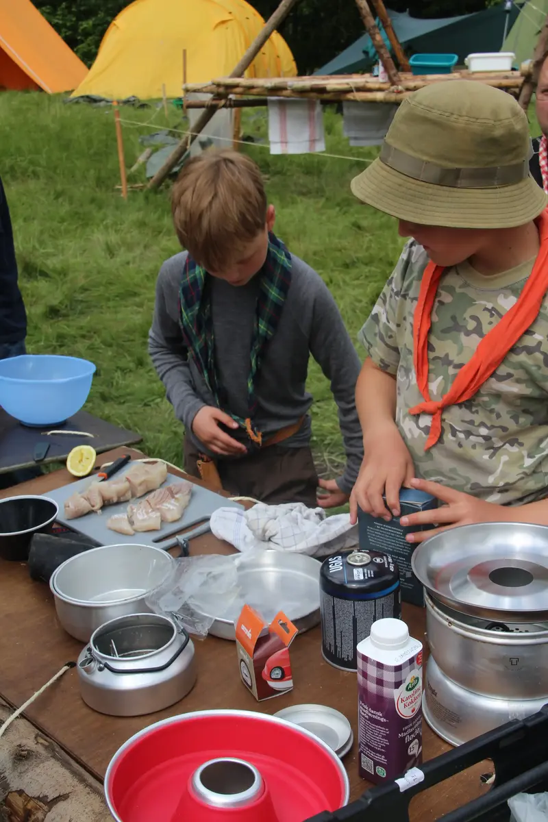 A couple of kids preparing food