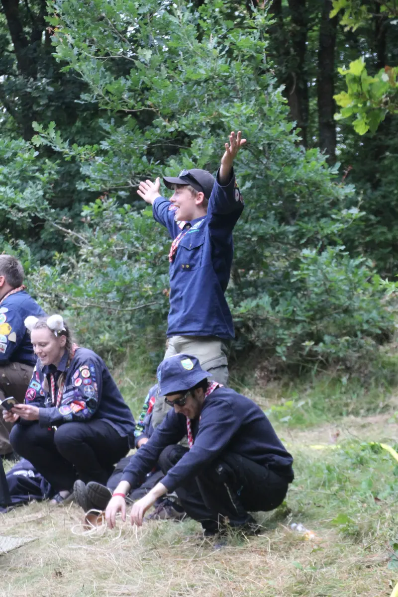 A young guy standing up above a crowd